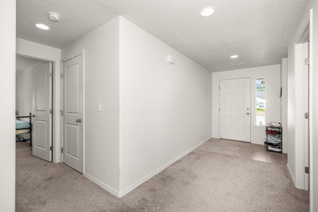 14520 E Everett Ct, Spokane Valley, WA 99216 - entrance foyer with carpet flooring, a textured ceiling, and recessed lighting