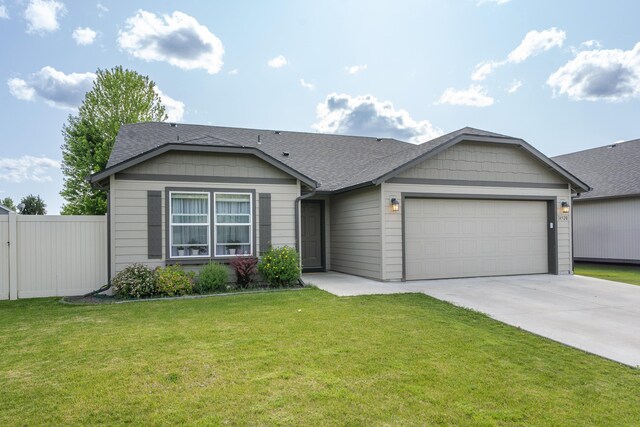 14520 E Everett Ct, Spokane Valley, WA 99216 - ranch-style home featuring an attached garage, roof with shingles, and driveway