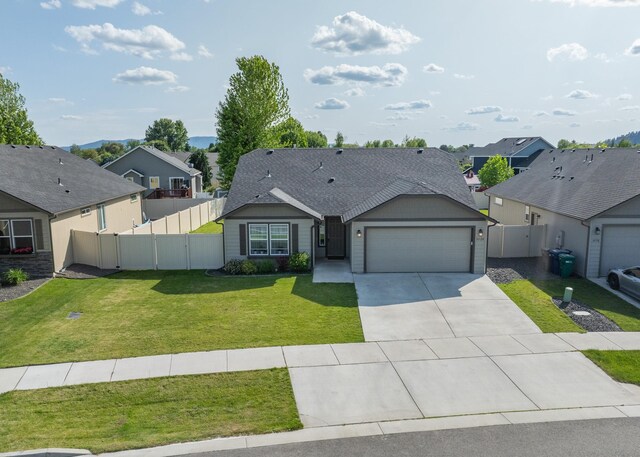 14520 E Everett Ct, Spokane Valley, WA 99216 - view of front of house with an attached garage, a residential view, concrete driveway, and a shingled roof