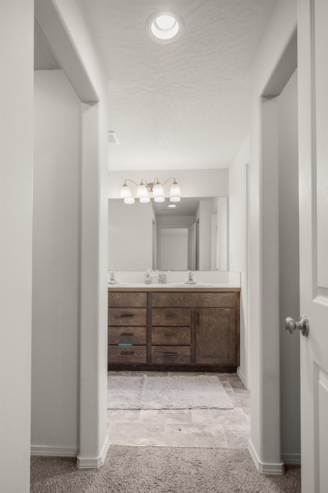 14520 E Everett Ct, Spokane Valley, WA 99216 - bathroom with double vanity and a textured ceiling