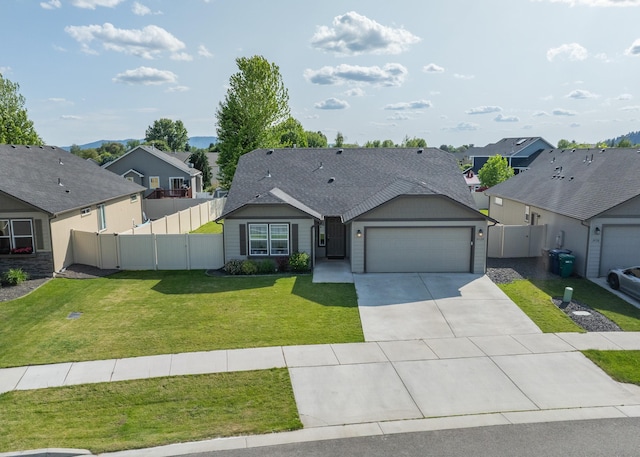 14520 E Everett Ct, Spokane Valley, WA 99216 - view of front of house with an attached garage, a residential view, concrete driveway, and a shingled roof