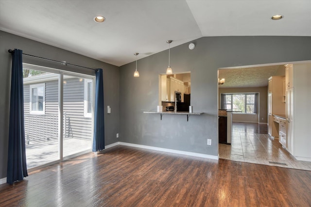 1411 Sinclair St, Davenport, WA 99122 - unfurnished living room featuring lofted ceiling, wood finished floors, and recessed lighting