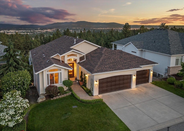 8422 E Sandlewood Ln, Spokane, WA 99217 - single story home with a garage, driveway, a yard, and a mountain view