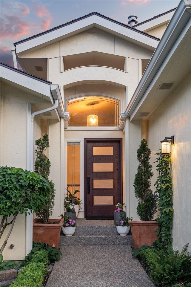 8422 E Sandlewood Ln, Spokane, WA 99217 - exterior entry at dusk featuring stucco siding
