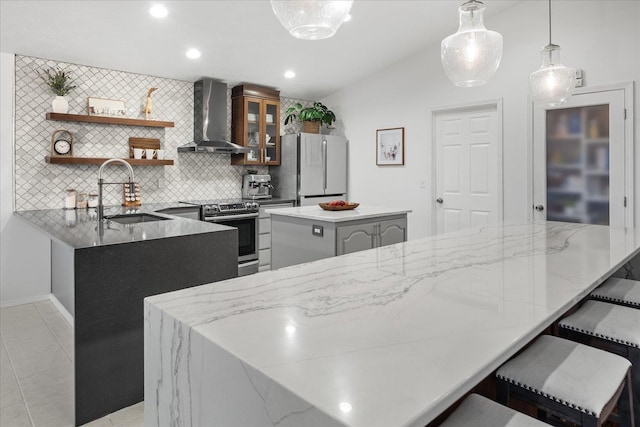 8422 E Sandlewood Ln, Spokane, WA 99217 - kitchen featuring wall chimney range hood, electric range, freestanding refrigerator, lofted ceiling, and a center island