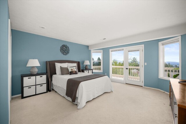 8422 E Sandlewood Ln, Spokane, WA 99217 - bedroom featuring access to exterior and light colored carpet