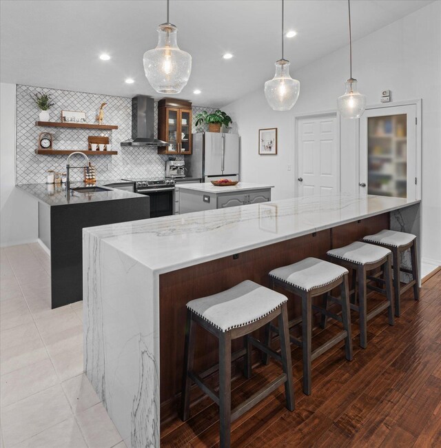 8422 E Sandlewood Ln, Spokane, WA 99217 - kitchen featuring wall chimney range hood, freestanding refrigerator, a center island, stainless steel electric stove, and open shelves