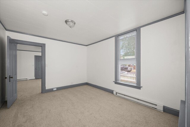2003 W Mallon Ave, Spokane, WA 99201 - carpeted empty room featuring a baseboard heating unit and baseboard heating