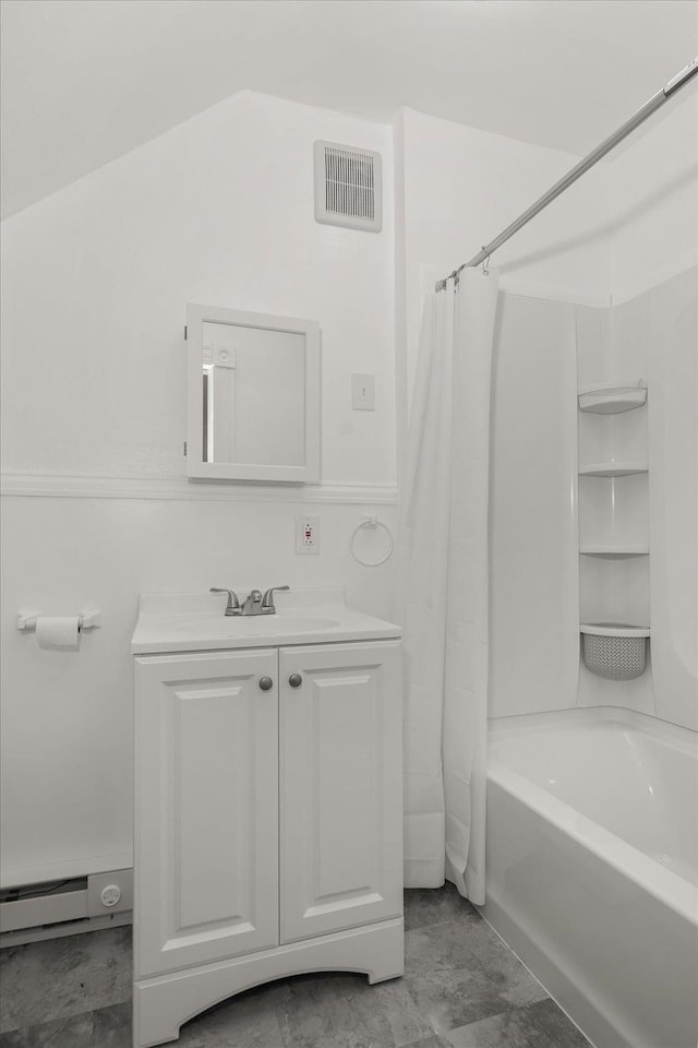2003 W Mallon Ave, Spokane, WA 99201 - bathroom featuring shower / bath combo with shower curtain, vanity, and baseboard heating