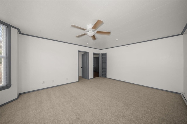 2003 W Mallon Ave, Spokane, WA 99201 - empty room with carpet flooring, a ceiling fan, and a baseboard heating unit