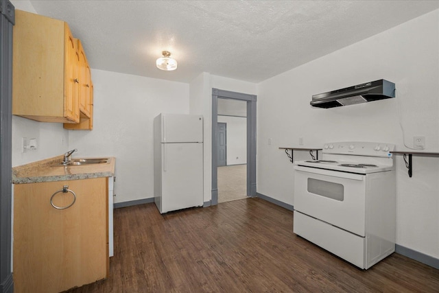 2003 W Mallon Ave, Spokane, WA 99201 - kitchen featuring white appliances, under cabinet range hood, dark wood-style floors, light countertops, and a textured ceiling