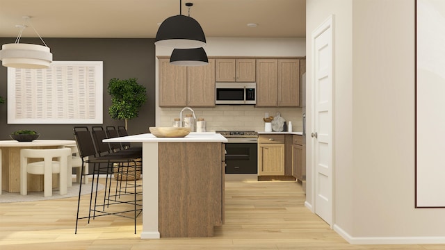 24812 E Hawkstone Loop, Liberty Lake, WA 99019 - kitchen featuring stainless steel electric stove, light wood-style flooring, tasteful backsplash, and a breakfast bar