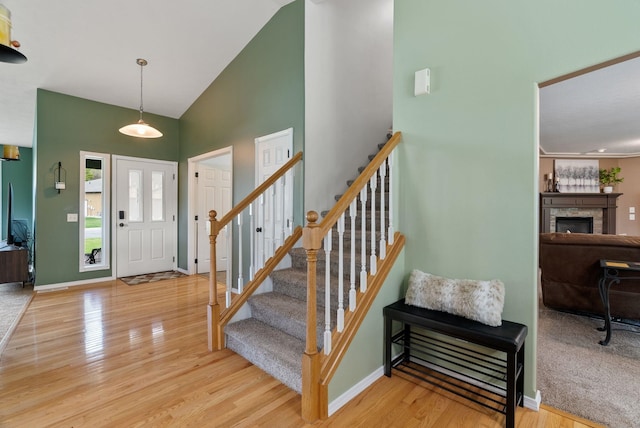 5981 Blackstone Way, Nine Mile Falls, WA 99026 - foyer featuring high vaulted ceiling, wood finished floors, and stairway