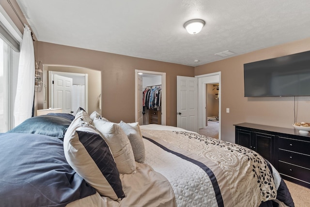 5981 Blackstone Way, Nine Mile Falls, WA 99026 - bedroom with carpet floors, a walk in closet, and a closet