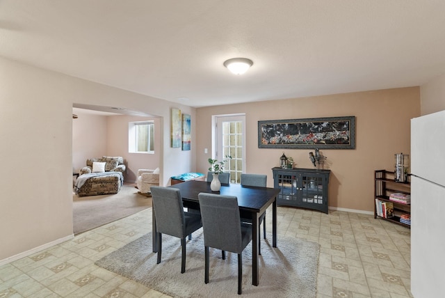5981 Blackstone Way, Nine Mile Falls, WA 99026 - dining space featuring arched walkways and light flooring