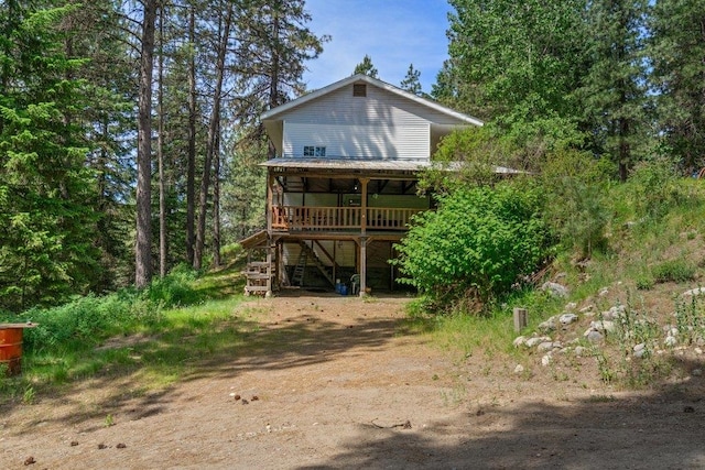 491 Winterfield Rd, Newport, WA 99156 - view of front of property with driveway, stairway, a wooden deck, and a carport