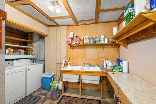 491 Winterfield Rd, Newport, WA 99156 - laundry room featuring washer and dryer, wooden walls, and tile patterned floors