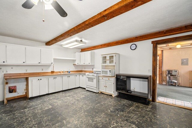 491 Winterfield Rd, Newport, WA 99156 - kitchen with white appliances, beam ceiling, white cabinets, open shelves, and a ceiling fan