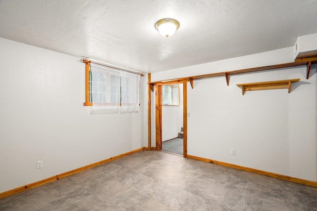 491 Winterfield Rd, Newport, WA 99156 - unfurnished bedroom featuring a textured ceiling, a closet, and tile patterned floors