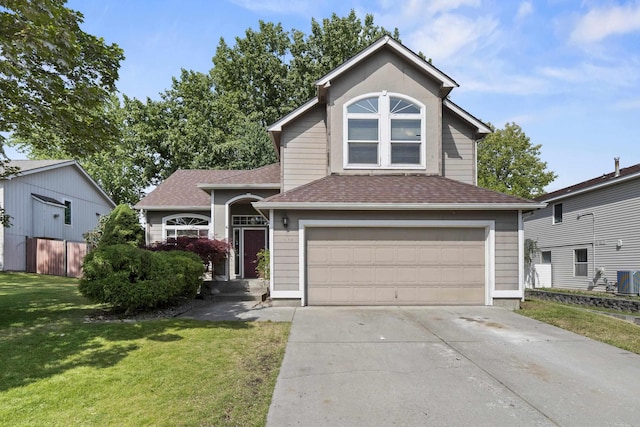 1707 N Harmony Ln, Greenacres, WA 99016 - traditional-style home with a garage, driveway, a front yard, and a shingled roof