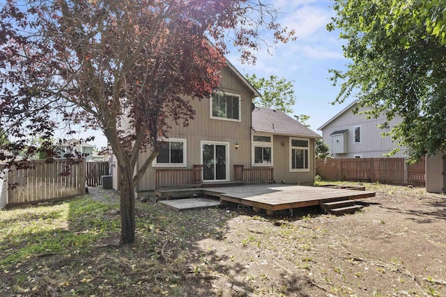 1707 N Harmony Ln, Greenacres, WA 99016 - rear view of house featuring a fenced backyard, a wooden deck, and a shingled roof