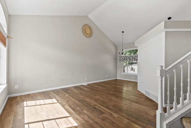 1707 N Harmony Ln, Greenacres, WA 99016 - spare room featuring wood finished floors, high vaulted ceiling, and stairs