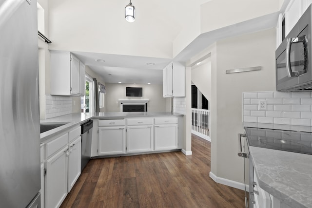1707 N Harmony Ln, Greenacres, WA 99016 - kitchen featuring stainless steel appliances, dark wood-style floors, white cabinets, backsplash, and recessed lighting