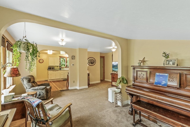 11 E Camden Rd, Elk, WA 99009 - living room with arched walkways and light colored carpet