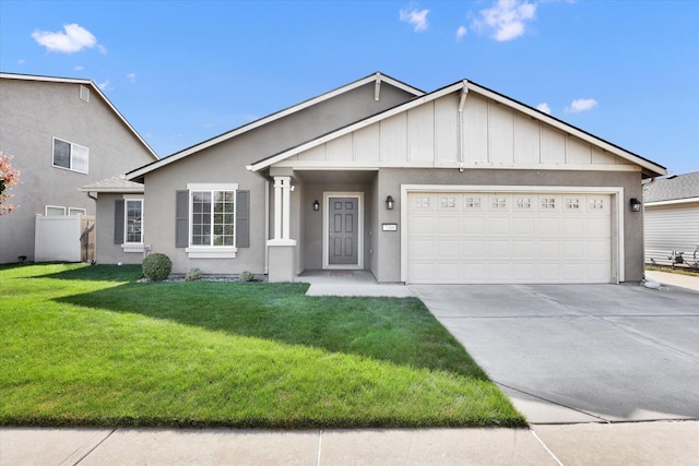 7316 S Dour St, Cheney, WA 99004 - ranch-style home featuring driveway, an attached garage, a front yard, stucco siding, and board and batten siding
