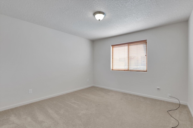 7316 S Dour St, Cheney, WA 99004 - empty room featuring light colored carpet and a textured ceiling