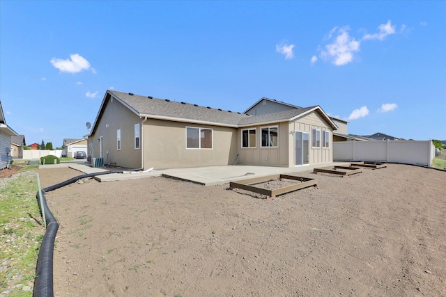 7316 S Dour St, Cheney, WA 99004 - back of property featuring a patio area and stucco siding