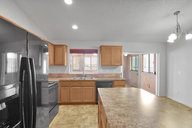 7316 S Dour St, Cheney, WA 99004 - kitchen with black appliances, a chandelier, light countertops, plenty of natural light, and recessed lighting
