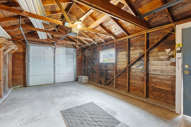 417 E Providence Ave, Spokane, WA 99207 - garage featuring a garage door opener, wood walls, and wood ceiling