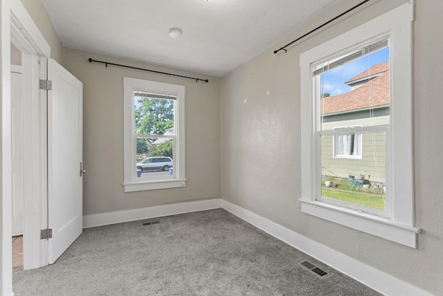 417 E Providence Ave, Spokane, WA 99207 - spare room featuring light carpet and baseboards