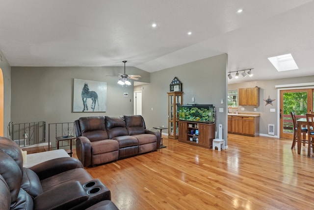 15007 W Willynwood Ln, Nine Mile Falls, WA 99026 - living area featuring light wood-style floors, a skylight, lofted ceiling, ceiling fan, and recessed lighting