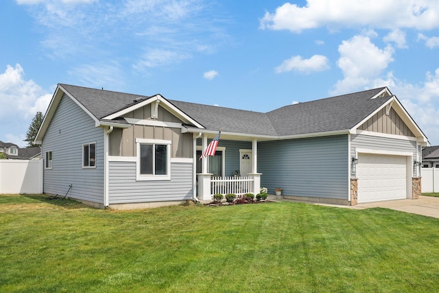 8630 W Campus Dr, Spokane, WA 99224 - view of front of property with board and batten siding, covered porch, an attached garage, and driveway