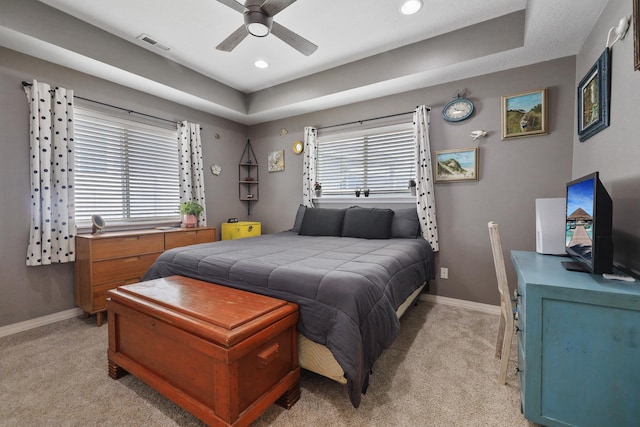 8630 W Campus Dr, Spokane, WA 99224 - bedroom with light colored carpet, a tray ceiling, recessed lighting, and a ceiling fan