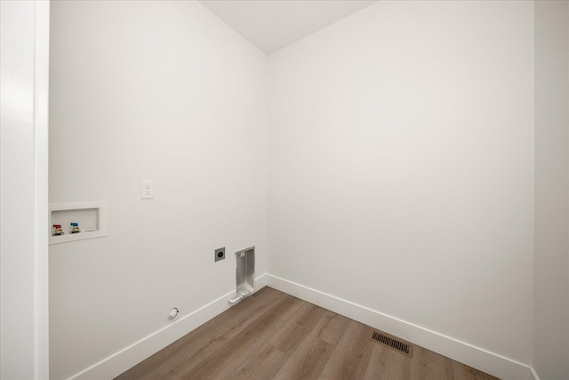 4219 W Tolliver Ct, Spokane, WA 99208 - laundry room featuring hookup for a washing machine, hookup for an electric dryer, wood finished floors, and gas dryer hookup