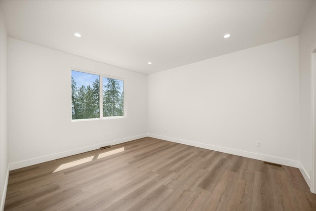 4219 W Tolliver Ct, Spokane, WA 99208 - unfurnished room with wood finished floors and recessed lighting