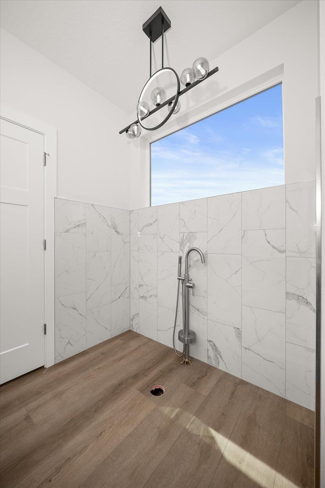 4219 W Tolliver Ct, Spokane, WA 99208 - bathroom featuring a chandelier and wood finished floors