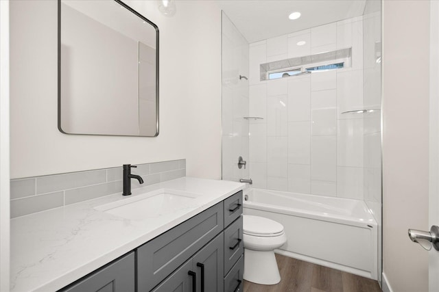 4219 W Tolliver Ct, Spokane, WA 99208 - bathroom featuring vanity, wood finished floors, and  shower combination