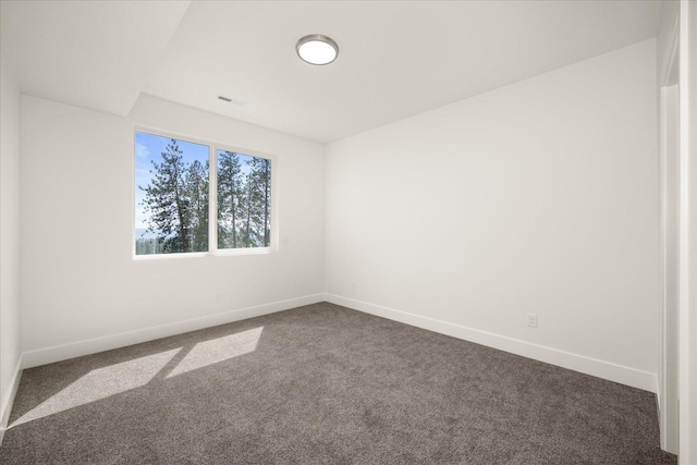 4219 W Tolliver Ct, Spokane, WA 99208 - empty room with dark carpet and baseboards