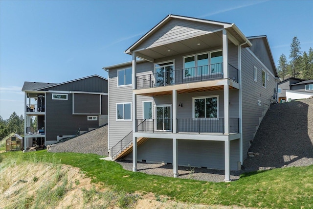4219 W Tolliver Ct, Spokane, WA 99208 - rear view of property with a balcony