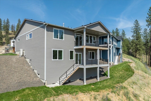 4219 W Tolliver Ct, Spokane, WA 99208 - back of house with a balcony and stairway
