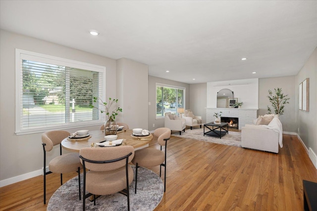 5615 N Forest Blvd, Spokane, WA 99205 - dining area with light wood-style floors, a brick fireplace, and recessed lighting