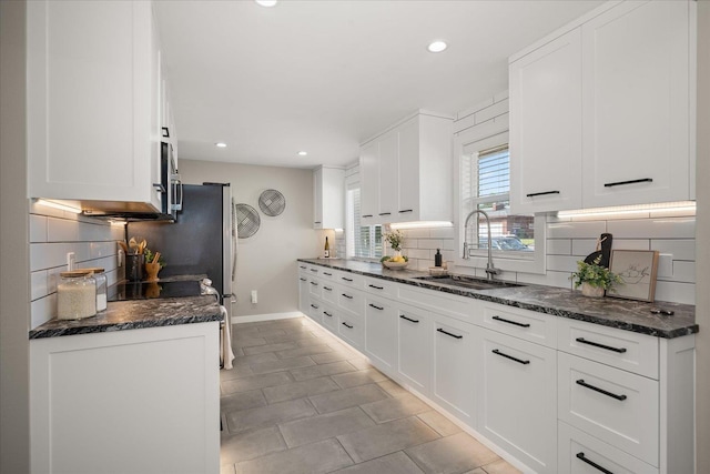 5615 N Forest Blvd, Spokane, WA 99205 - kitchen with backsplash, white cabinets, and recessed lighting
