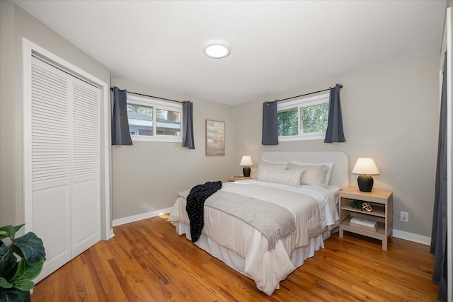 5615 N Forest Blvd, Spokane, WA 99205 - bedroom with multiple windows, light wood finished floors, and a closet
