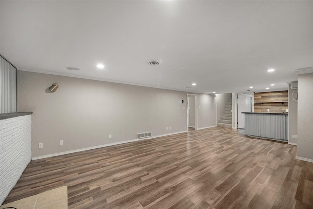 5615 N Forest Blvd, Spokane, WA 99205 - unfurnished living room with stairway, wood finished floors, recessed lighting, and ornamental molding