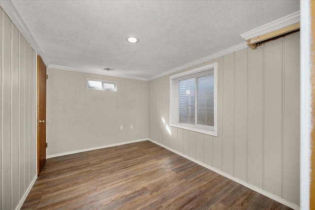 5615 N Forest Blvd, Spokane, WA 99205 - empty room featuring wood finished floors, crown molding, and a textured ceiling
