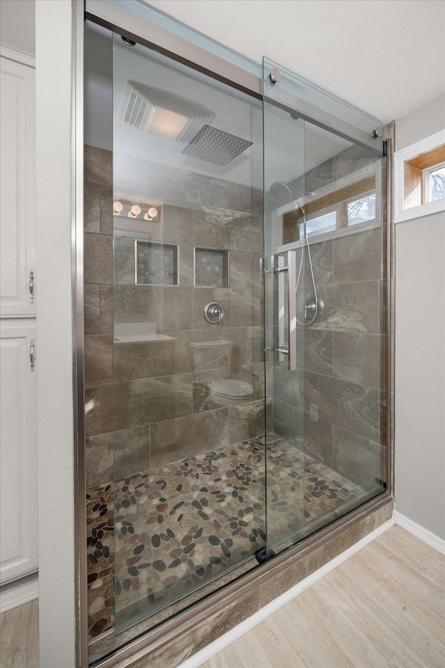 5615 N Forest Blvd, Spokane, WA 99205 - full bathroom featuring a shower stall and wood finished floors